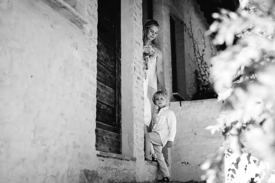 A bride leaving the bridal suite with her son